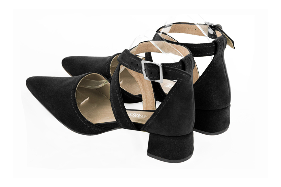 Women's matt black open side dress shoes, with crossed straps. Tapered toe. Low flare heels - Rear view